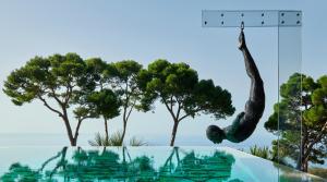 a sculpture of a person hanging from a tree at Hotel Scalinatella in Capri