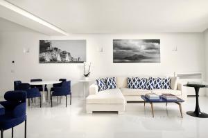 a living room with a couch and a table at Hotel Scalinatella in Capri