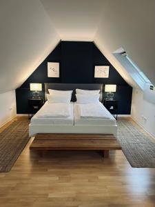 Postel nebo postele na pokoji v ubytování DK Hotel Heidelberg