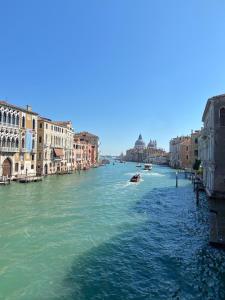 a view of a river in a city with buildings at Dimora Contarini Charm Apartment on Grand Canal in Venice
