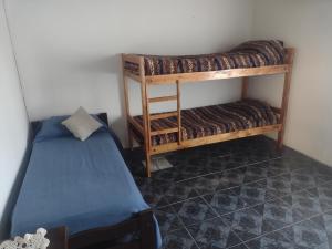 a room with two bunk beds and a bed at Casa Los Acantilados in Mar del Plata
