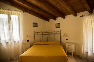 Кровать или кровати в номере Agriturismo Mandrola
