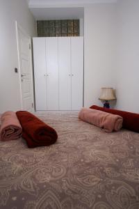 Postel nebo postele na pokoji v ubytování Merkuri apartments