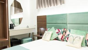 Letto o letti in una camera di Aries Suite Pompei