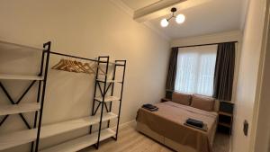 Postel nebo postele na pokoji v ubytování Merkuri apartments