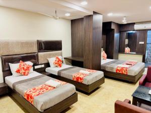 a hotel room with two beds at Sheraton Grande Hotel - Business Class Hotel - Near Central Railway Station in Chennai