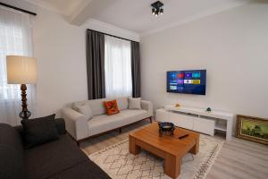 TV a/nebo společenská místnost v ubytování Merkuri apartments