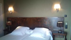 Postel nebo postele na pokoji v ubytování Hotel Grifeu