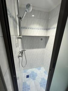 a shower with a glass door in a bathroom at Pattaya beach condo in Pattaya