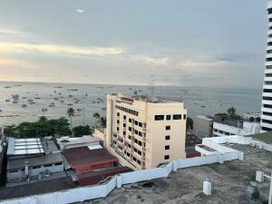 an aerial view of a building and the ocean at Pattaya beach condo in Pattaya