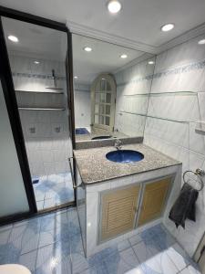a bathroom with a sink and a shower at Pattaya beach condo in Pattaya