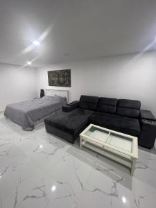 a living room with a couch and a bed at Pattaya beach condo in Pattaya
