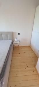 a small room with a bed and a table in it at Moon in Pignataro Maggiore