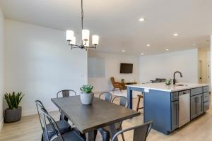 a kitchen and living room with a table and chairs at Inviting American Fork Home with Community Pool! in American Fork