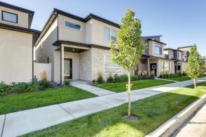 a row of houses with trees in a yard at Inviting American Fork Home with Community Pool! in American Fork
