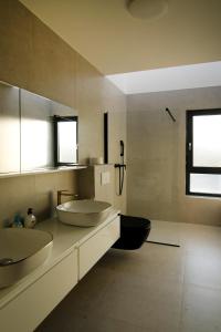 a bathroom with two sinks on a counter at Neptunia - 4 bedroom villa in Medulin +29 photos