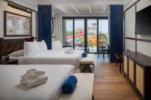 Llit o llits en una habitació de Ocean Coral Spring Resort - All Inclusive