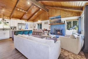a living room with two couches and a fireplace at Ursa Major- Ultra Modern Resort Duplex- in Big Bear Lake