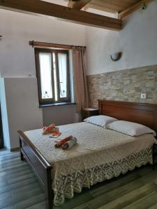 Katil atau katil-katil dalam bilik di Agriturismo 'Rian d'oliva
