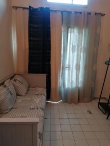 Ένα ή περισσότερα κρεβάτια σε δωμάτιο στο Superbe studio proche de toutes commodités