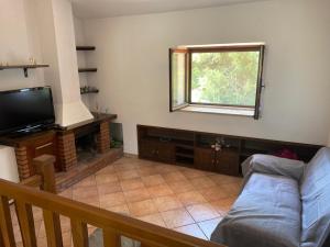 TV a/nebo společenská místnost v ubytování A CASA DI GIÒ & GIÒ
