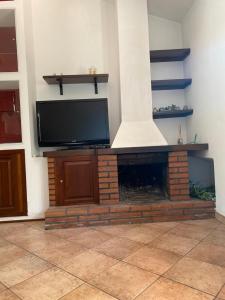 TV a/nebo společenská místnost v ubytování A CASA DI GIÒ & GIÒ