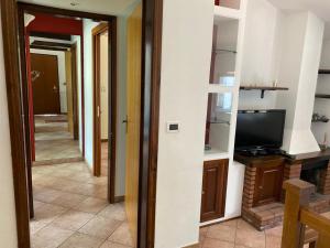 TV a/nebo společenská místnost v ubytování A CASA DI GIÒ & GIÒ