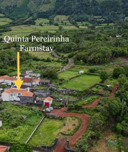 una vista aérea de un pequeño pueblo en un bosque en Quinta Pereirinha Farm - Bed & Breakfast - Pico Island, Azores - Private 3 Bedroom Home on a Working Farm w Ocean Views, en São Roque do Pico