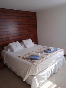 Een bed of bedden in een kamer bij Hostal JC