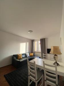 a living room with a table and a couch at Apartament Celna in Nysa +11 photos