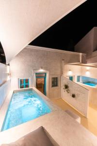 a large swimming pool in a house at Marla Luxury Residences in Megalokhori