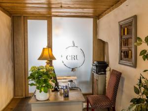 a living room with a table and a lamp at CRU Hotel in Tallinn