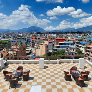 a view of a city from the roof of a building at Boudha Apart Hotel in Kathmandu