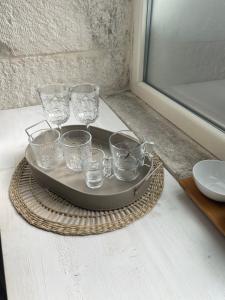 a tray with glasses on top of a table at Amarcord private Spa Ostuni in Ostuni +45 photos