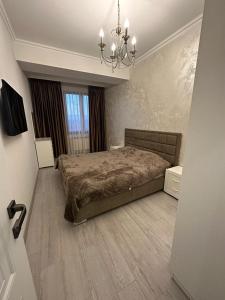 Postel nebo postele na pokoji v ubytování Apartment in Yerevan On Arghutyan Street
