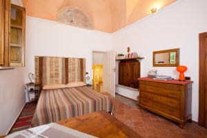 Postel nebo postele na pokoji v ubytování B&B Cascina Moncrava