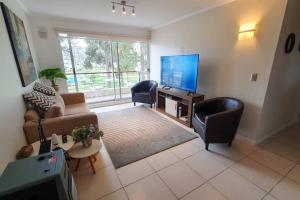 Posezení v ubytování Condominio en El Tabo - tranquilidad y seguridad