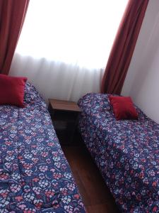 A bed or beds in a room at Condominio Mirador de Coquimbo