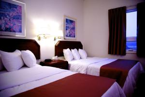 Katil atau katil-katil dalam bilik di Hotel Port Aux Basques