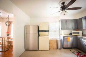 a kitchen with a refrigerator and a ceiling fan at Birmingham Home/2BR/Close to everything! in Birmingham