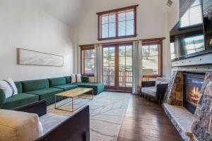 a living room with a couch and a fireplace at Penthouse in One Ski Hill in Breckenridge