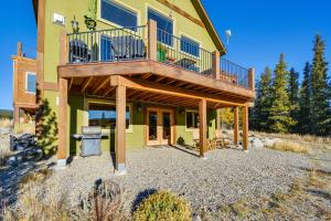 a house with a deck on the side of it at Cozy Alma Mountain Retreat Fireplace and Grill in Alma