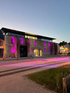 a building with pink lights on the side of it at CAP SUR SAINT-VAL in Saint-Valery-sur-Somme