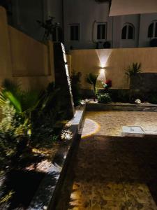a courtyard with plants and a building at night at Villa Silia in Sharm El Sheikh