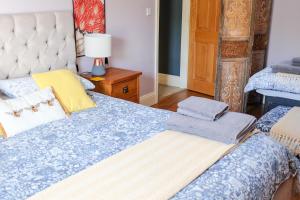 a bedroom with a bed with two towels on it at Little Lodge on the Yorkshire Wolds in York