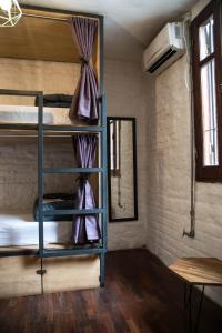 Postel nebo postele na pokoji v ubytování MedioMundo Hostel