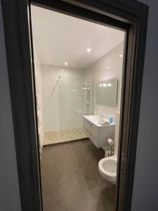 a bathroom with a toilet and a sink and a shower at Thegreatflat in Paris