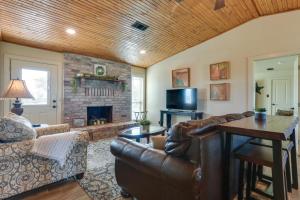 a living room with a couch and a fireplace at Ranch Getaway with Pool and Horse Stall Access! in Calera