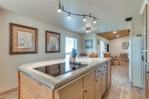 a kitchen with a counter top and a refrigerator at Ranch Getaway with Pool and Horse Stall Access! in Calera