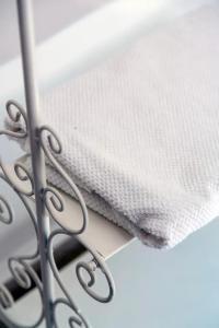 a close up of a white pillow on a bed at Opera Studio Apartment in Budapest